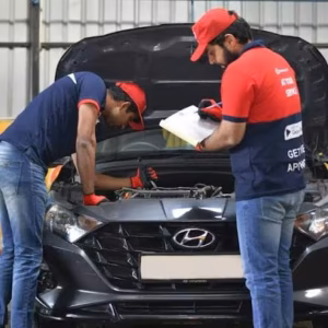 Auto mechanic inspecting car